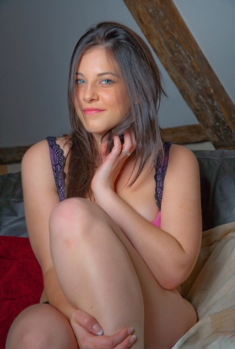 Pretty blue eyed Bes teases on the couch with big tits in sexy pink bra