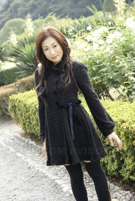 Fully clothed Japanese teen models in the park in black clothes and stockings