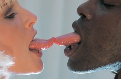 Big titted blonde Emilia seduces a well hung black porter in her hotel room