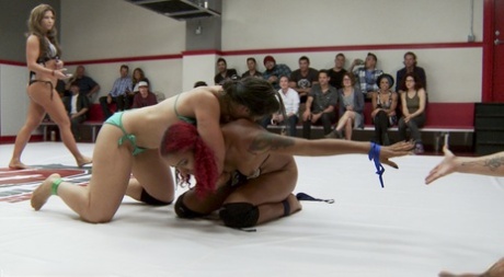 Busty MILF Dee Williams and another pornstar fight naked in a wrestling ring