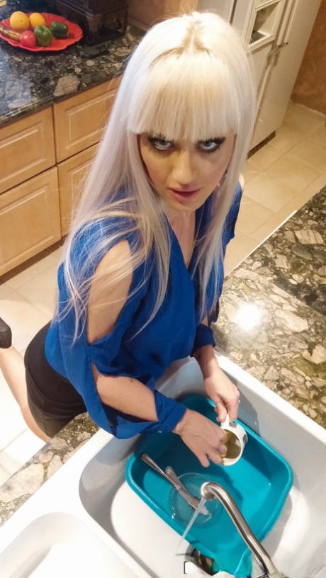 Blonde MILF with fake breasts Kacy Lane and her stepdaughter share a cock