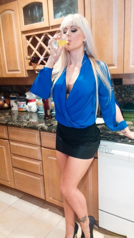 Blonde MILF with fake breasts Kacy Lane and her stepdaughter share a cock