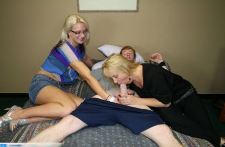 Blonde amateur swinger moms share a young tasty dick orally on a bed