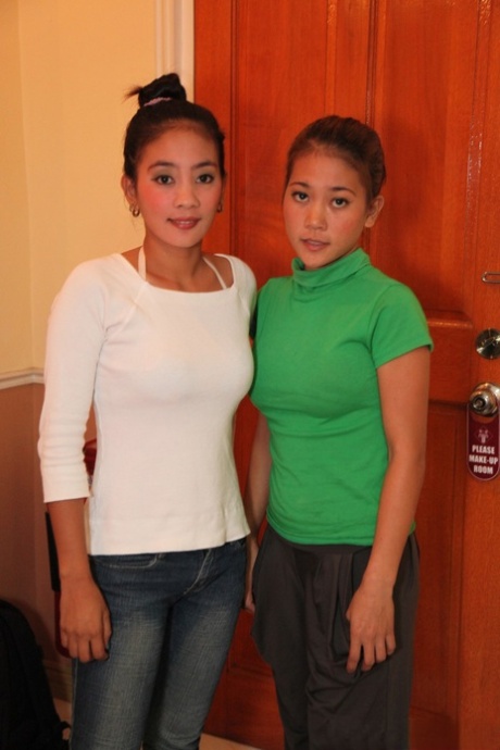Petite Filipina babes April Dizon & May Capangpangan undress & share a dick