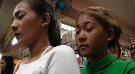 Petite Filipina babes April Dizon & May Capangpangan undress & share a dick