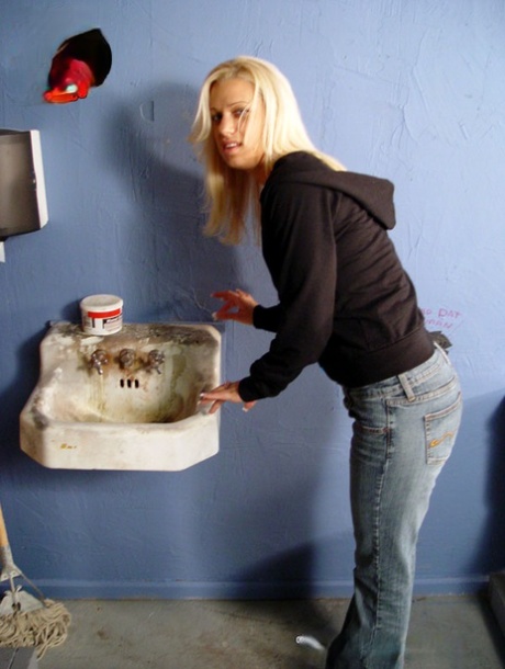 Blonde MILF Mia Bangg shows her curves and kneels to suck a gloryhole BBC