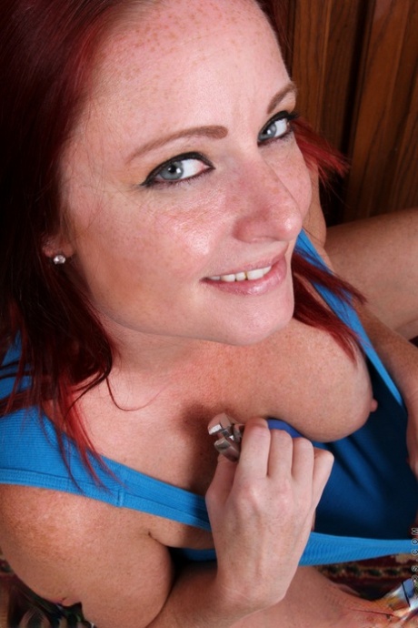 Busty redhead plumber Sandi Lymm strips and washes her hot pussy in the sink